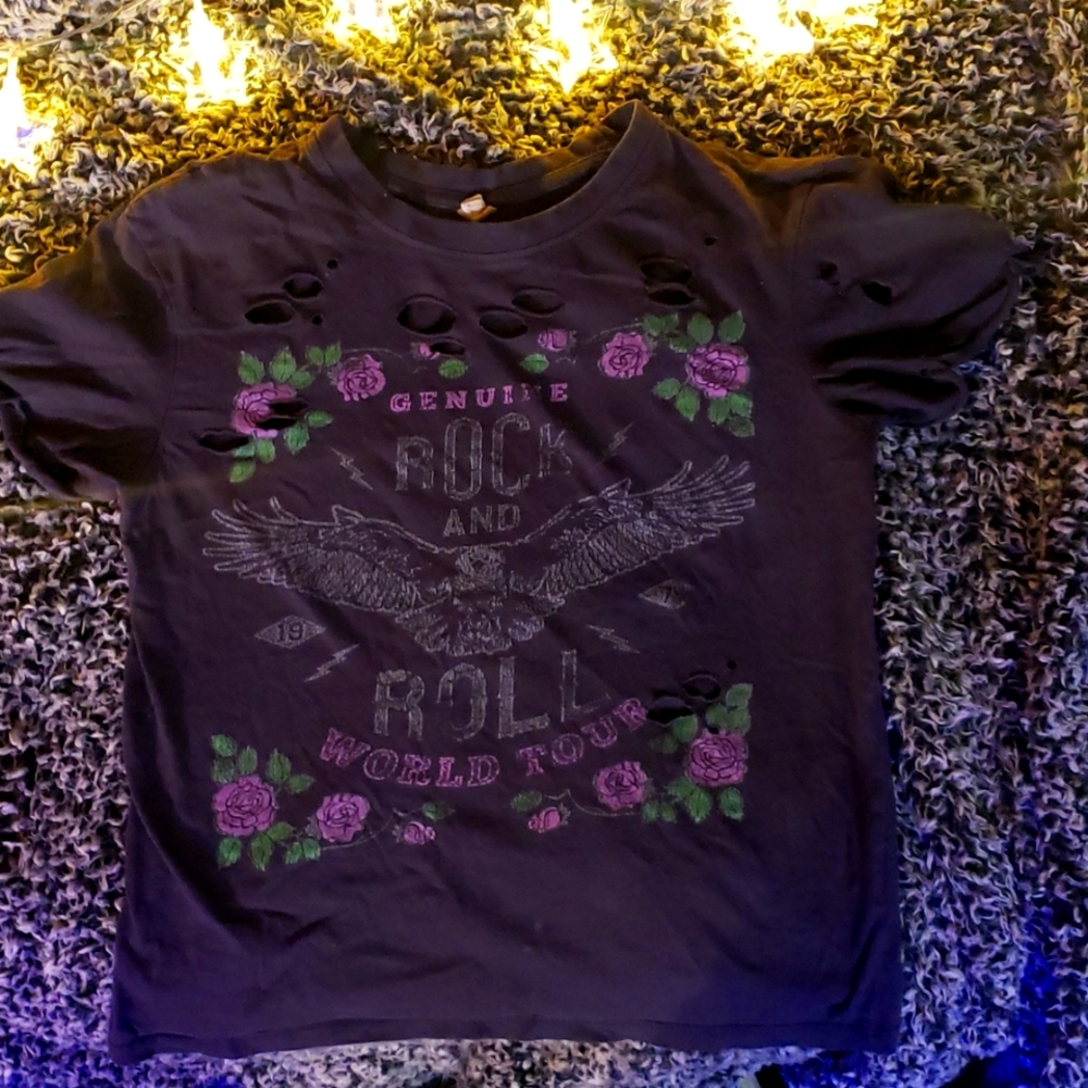 Really cute grey and purple, rock and roll shirt with holes around the top.